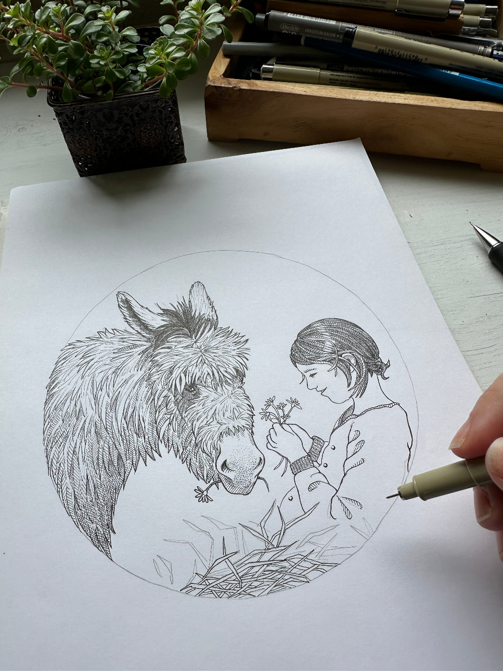 Bestillingsopgave med tegning af pige og sel